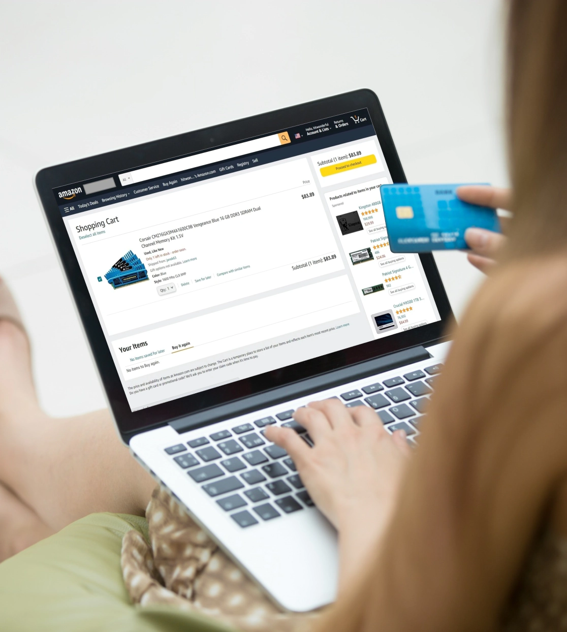 Person shopping online with a laptop and credit card