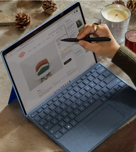 Person using a pen on a touchscreen laptop