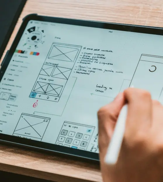 Tablet screen showing UI wireframe sketches and notes