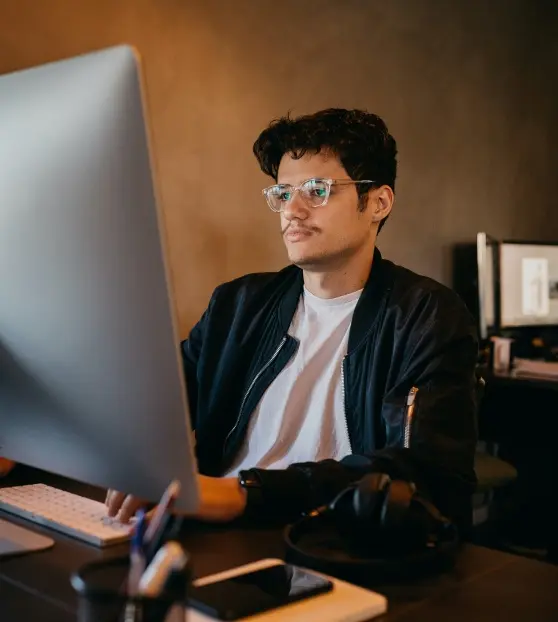 Person working on a computer in an office settingfor Web Application Development