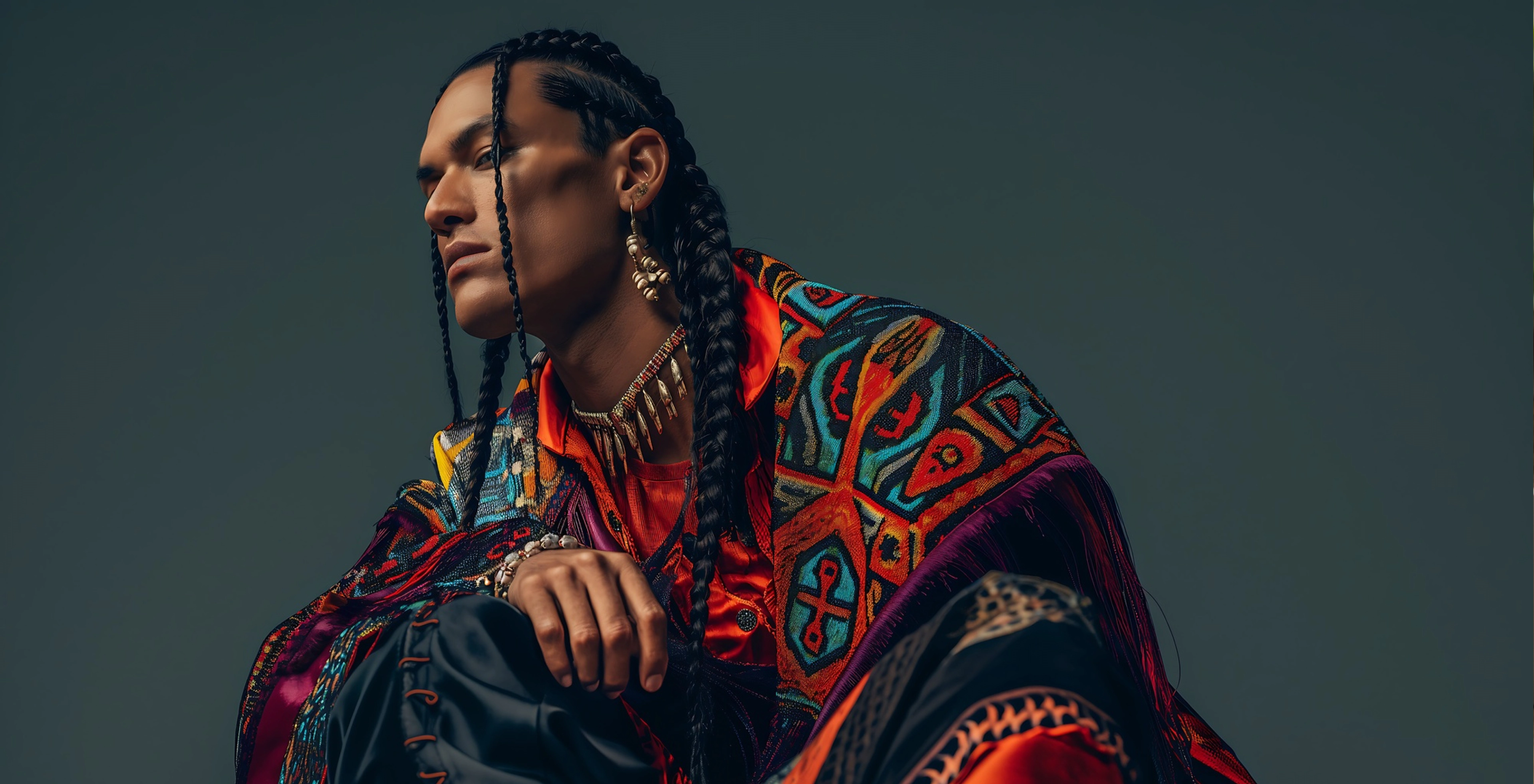 Fashion eCommerce banner featuring model in tribal-inspired outfit and statement accessories